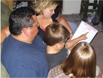 A family going over their home's evacuation guide.